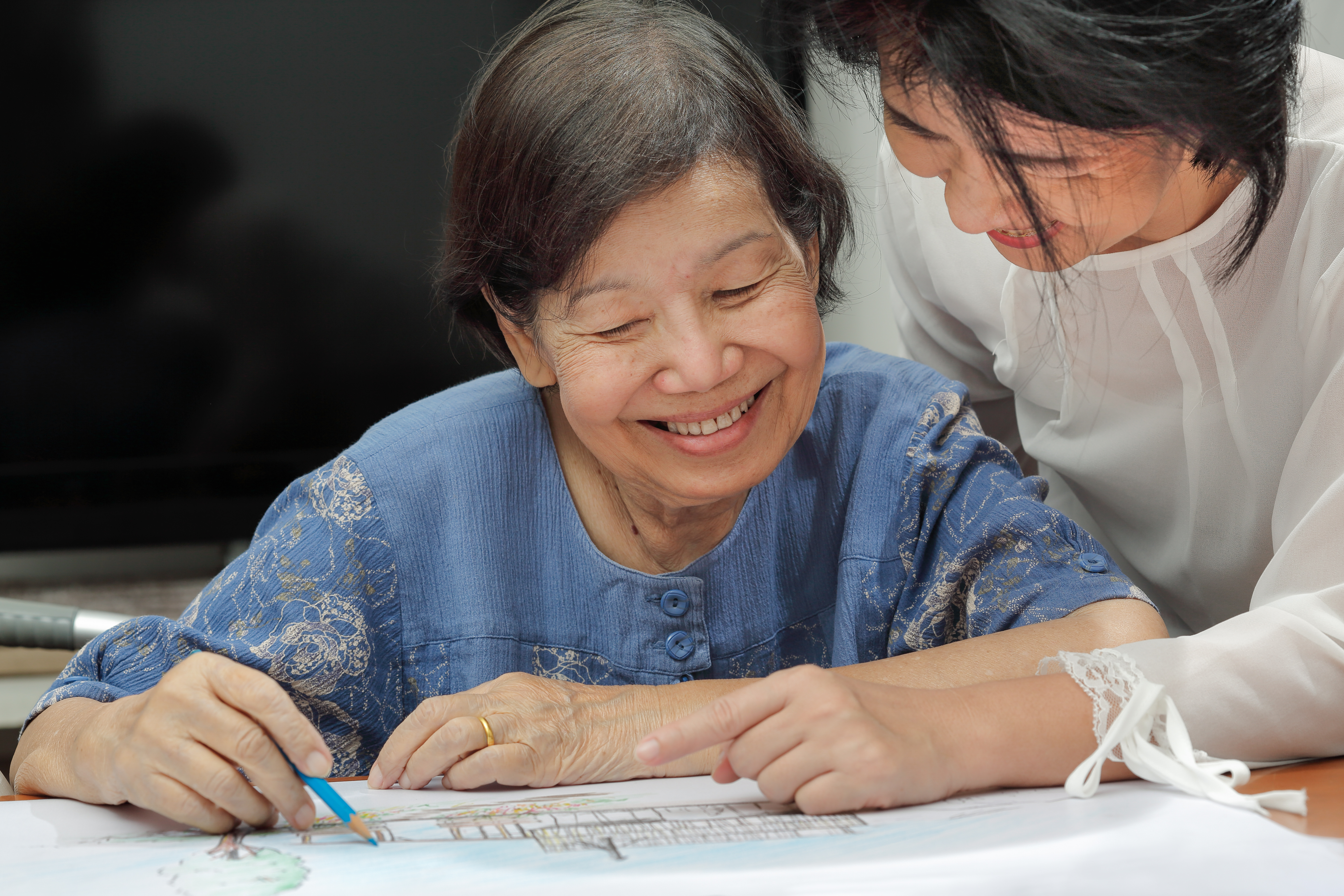 Older Asian women drawing 