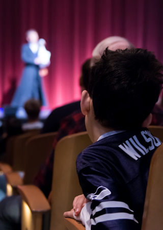 Boy watching theatre
