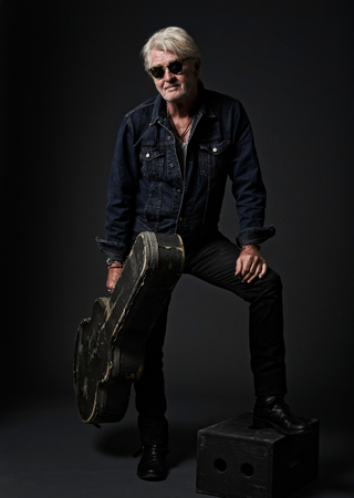 Tom Cochrane in sunglasses
