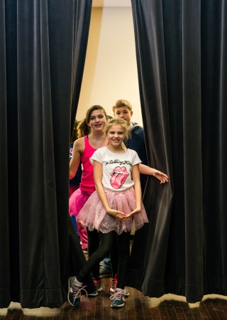 Girl at a Curtain on stage