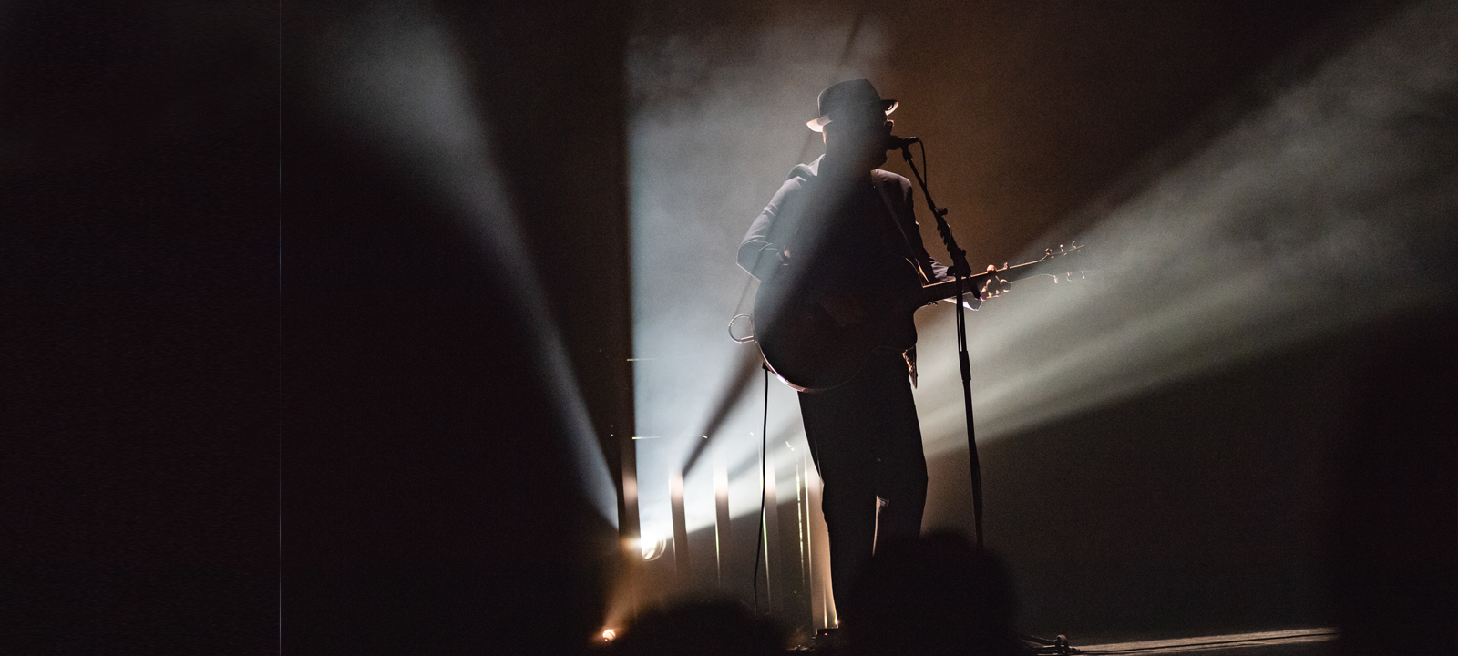 male performer singing on stage