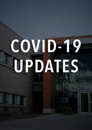 Town Hall with the words COVID Updates on top