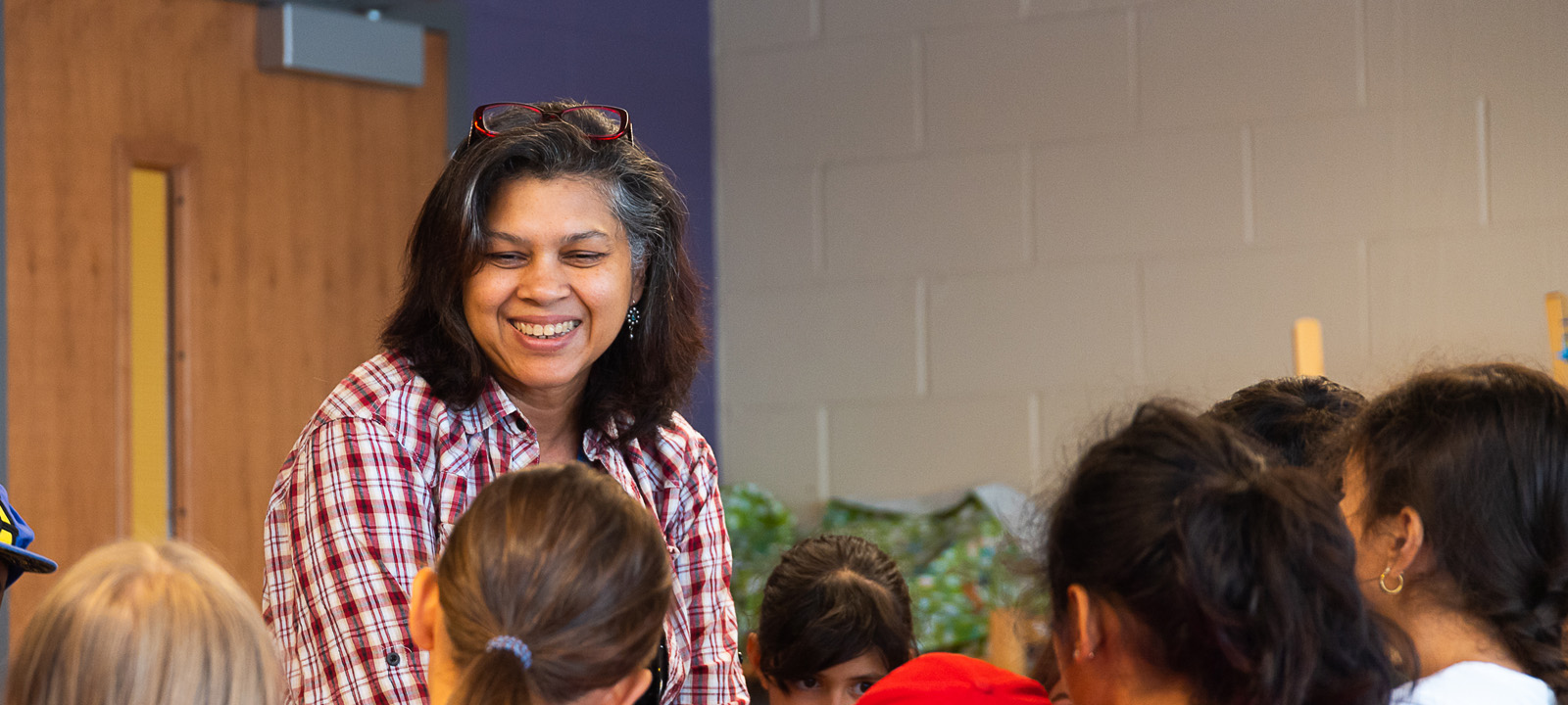 Arts teacher smiling at students